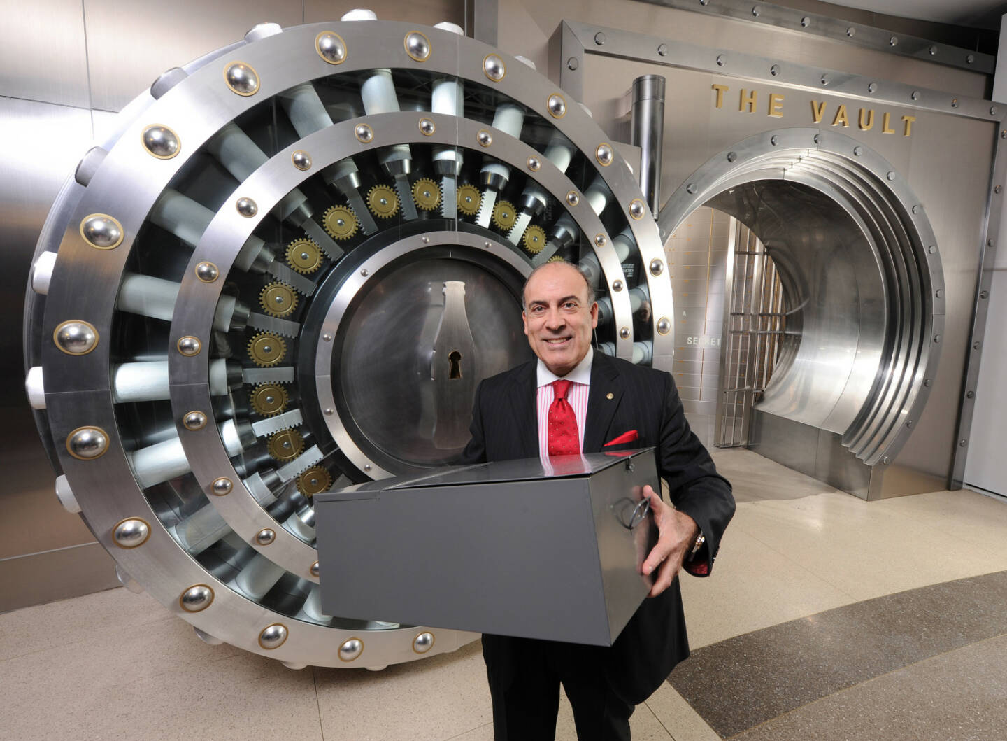 Coca-Cola Company Chairman and CEO Muhtar Kent holds the safety deposit box containing the 125-year-old secret formula for Coca-Cola