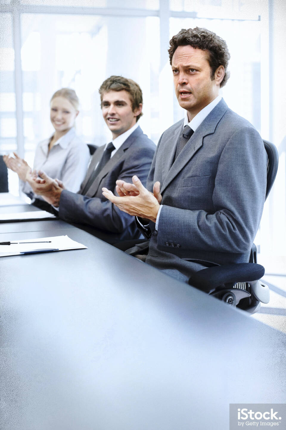 Dan Trunkman applauds a successful meeting, Vince Vaughn - iStock, Getty Images