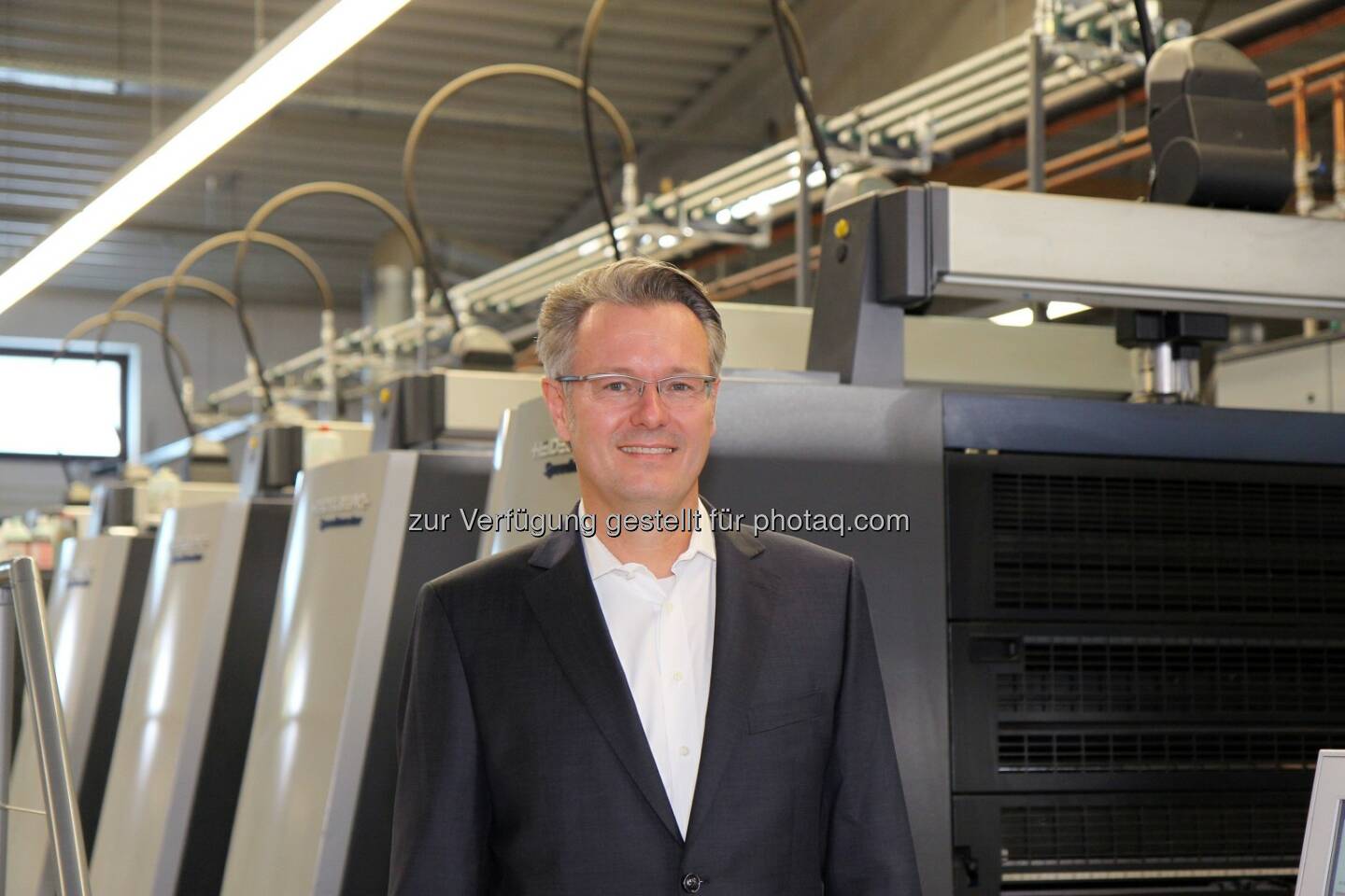 Michael Fries auf dem Podium des Online Print Symposium 2015 in München