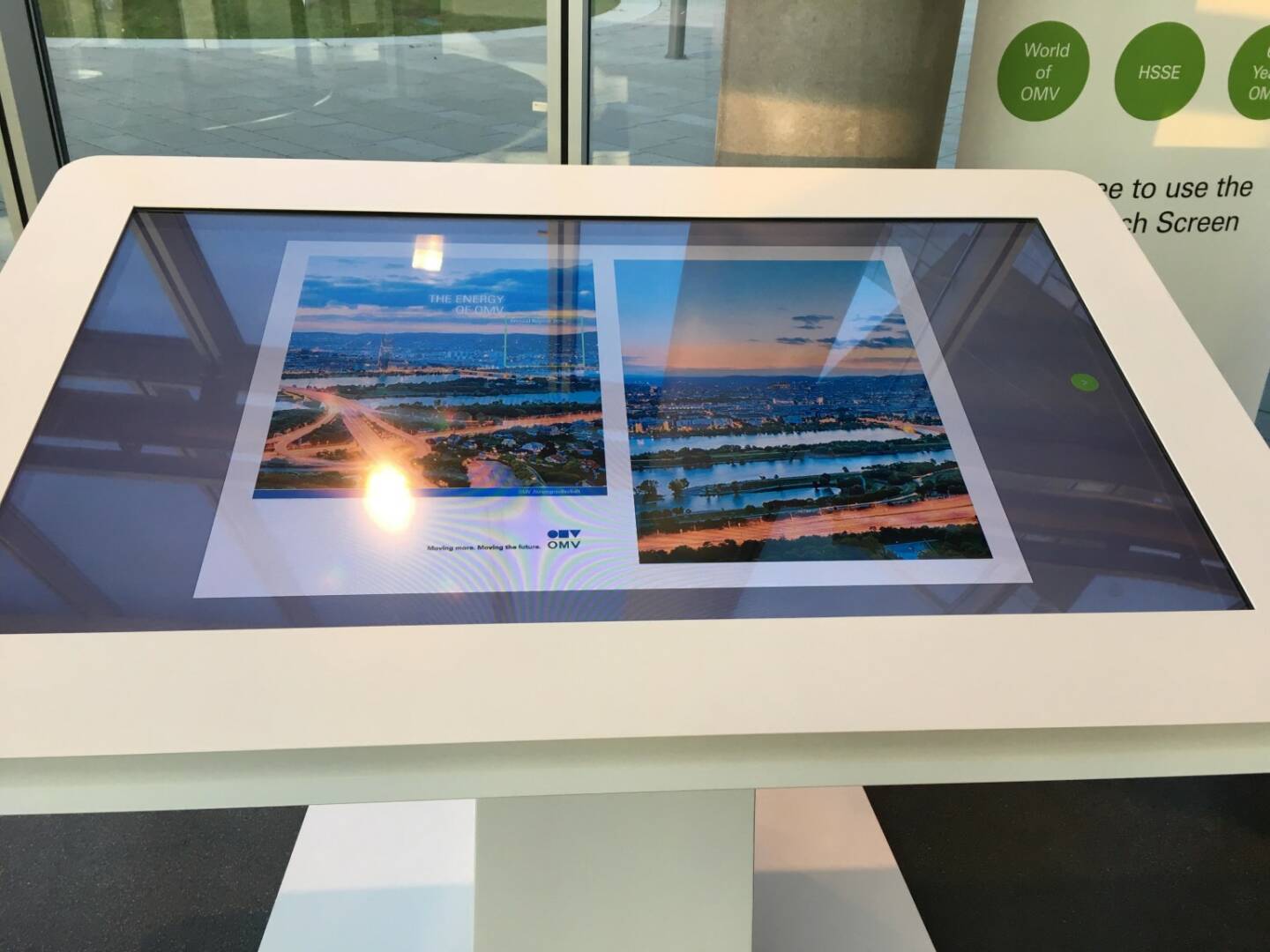 Bernhard Heneis OMV - Waiting at the OMV headquarters can be interesting . Just flip through the Annual Report at the mega multi touch board.